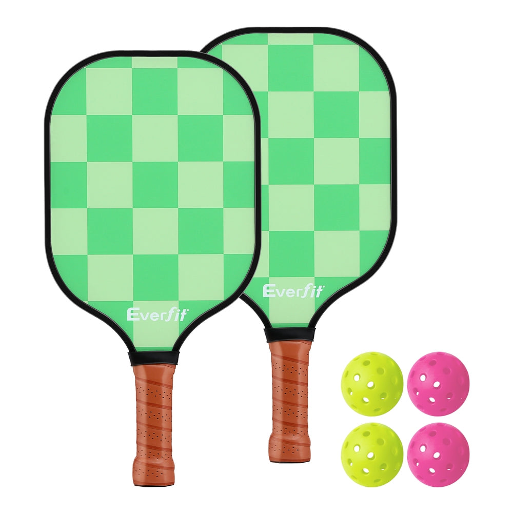 Two green checkered pickleball paddles and 2 indoor and 2 outdoor pickleballs