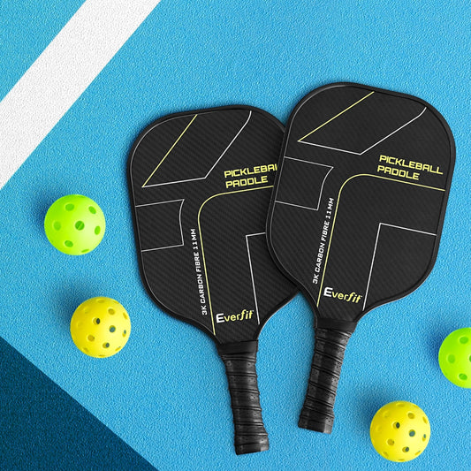 Two pickleball paddles with 'Everfit' branding on a blue background with yellow pickleballs