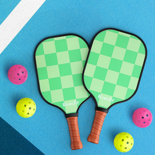 Two green checkered pickleball paddles with 2 sets of colorful balls.
